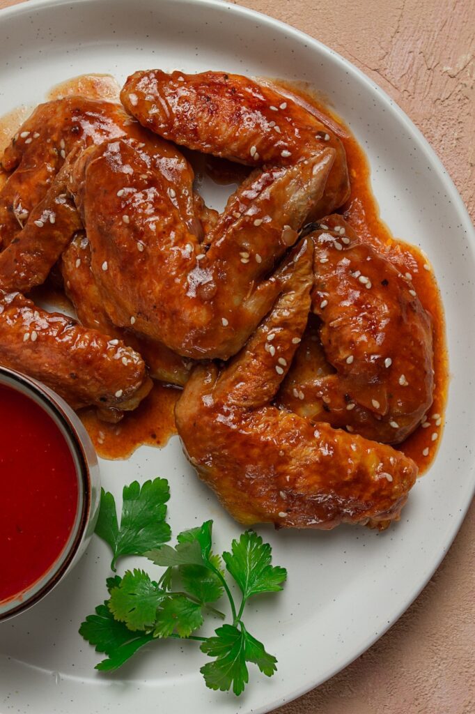 Chicken wings, with barbecue sauce, with tomato sauce, fast food, no people,